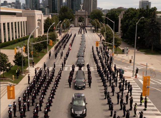 Toronto police officer killed in the line of duty remembered - https://cdn.connectfm.ca/4513C2BB-C3CD-43E0-8513-D3E0AC4714FC_Story1296739_1875517.jpg