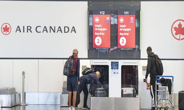 WestJet raises checked baggage fees following Air Canada, citing industry pressures - https://cdn.connectfm.ca/Air-canada_2025-08-21-161538_ixim.jpg