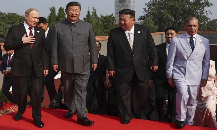 putin-meets-north-koreas-kim-in-beijing