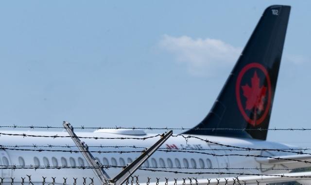 Air Canada flight attendants picketing at airports - https://cdn.connectfm.ca/air-canada_2025-08-11-134620_gggk.jpg
