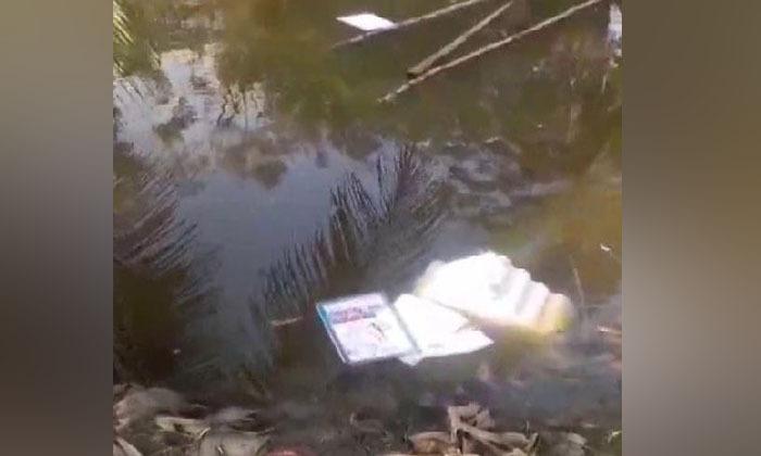 west-bengal-mob-loots-evm-throws-vvpat-machine-in-pond